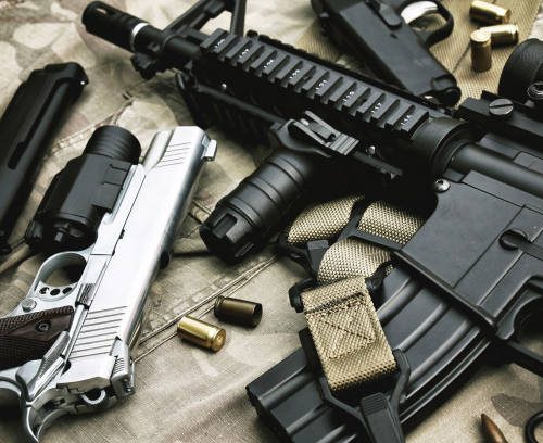 Weapons and military equipment for army, Assault rifle gun (M4A1) and pistol on camouflage background.